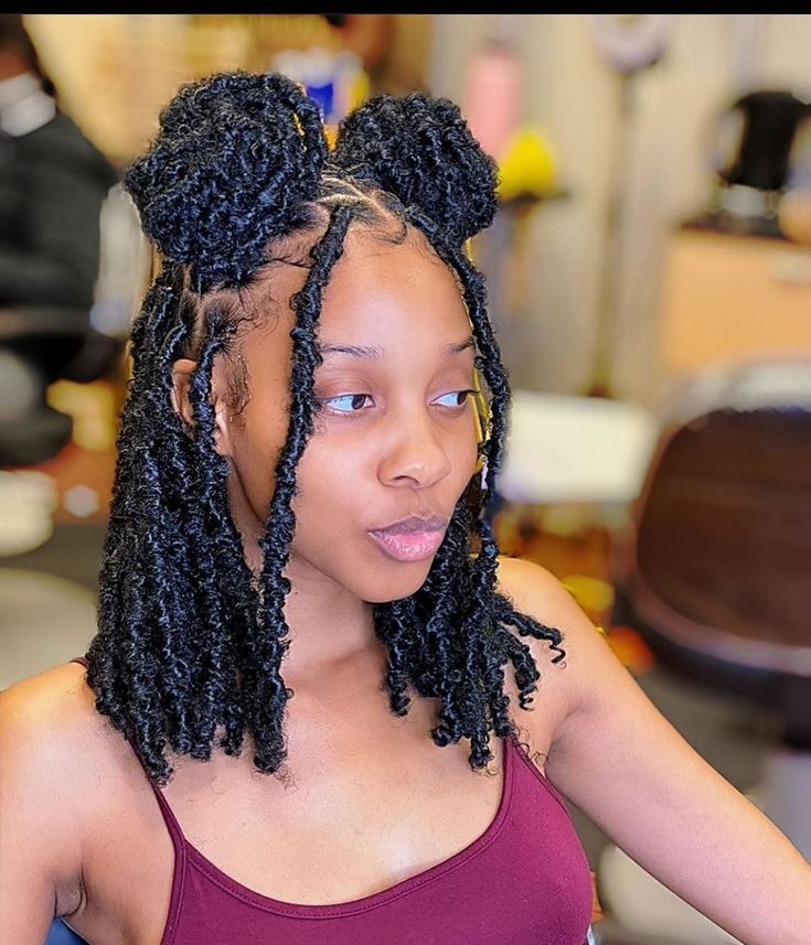 Two butterfly loc buns
